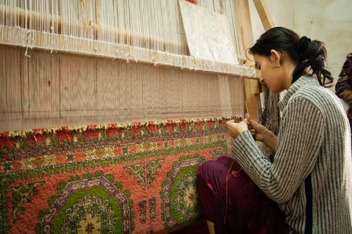 An artisan's hands at work, the kind of skilled labour our fair-pay structure is built to compensate properly.